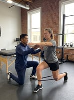 Patient working with a provider at a running physical therapy clinic in Farmers Branch