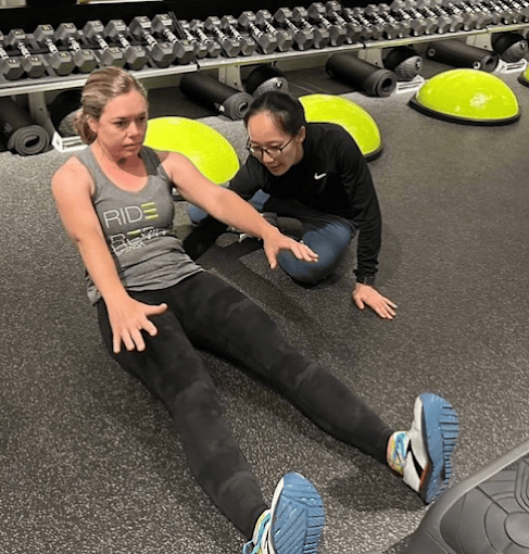 Patient working with a provider at a running physical therapy clinic in Farmers Branch, TX during a running gait analysis assessment